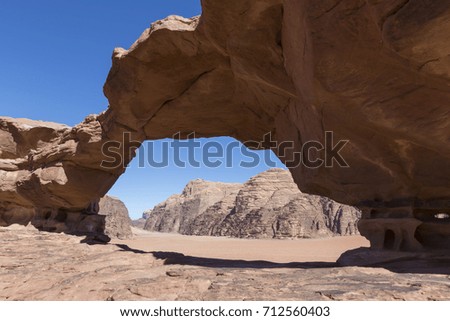 Natural rock bridge and panoramic view of Wadi Rum desert, Jordan