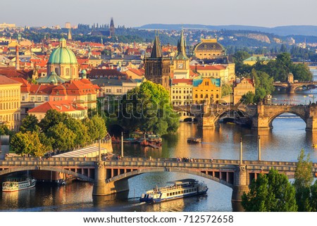 Scenic summer sunset aerial view of the Old Town pier architecture and Charles Bridge over Vltava river in Prague, Czech Republic