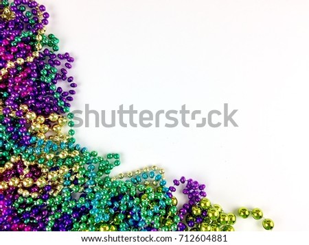 Colorful beads on a white surface with copy space