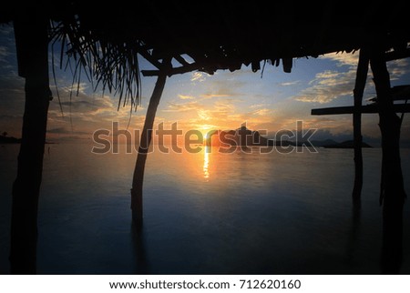 Beautiful sunrise taken from below the floating house at the sea