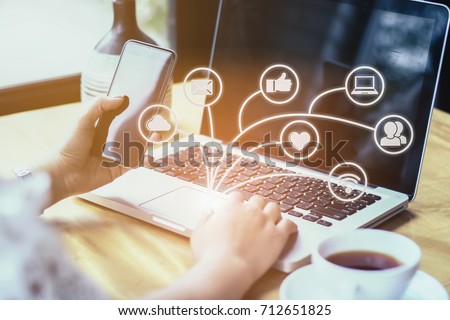 brainstorm teamwork meeting concept,businessman using mobile phone and digital tablet and laptop computer in modern office with virtual icon diagram Royalty-Free Stock Photo #712651825