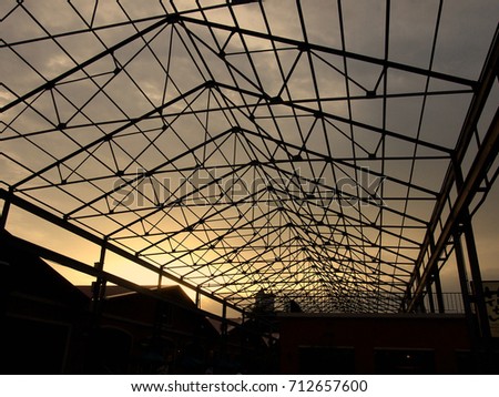 Pictures of Silhouette steel structure roof and beautiful sky, when sunset in the evening