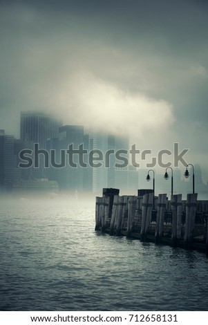 New York City downtown business district with pier in a foggy day