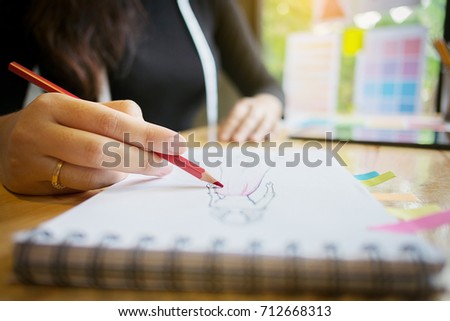 young stylish designer tailor working at a home studio