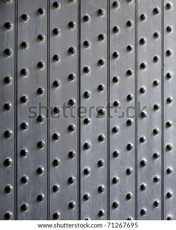 Patterns of dots on wooden door