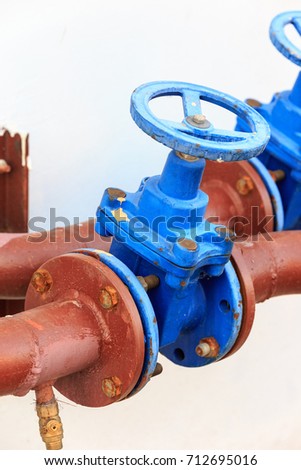 Fire plug with metal flange for water supply.