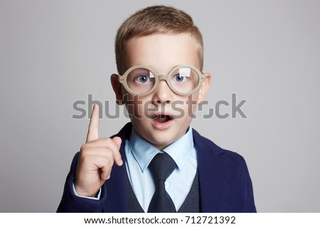funny child in glasses and suit.genius Kids.idea Royalty-Free Stock Photo #712721392