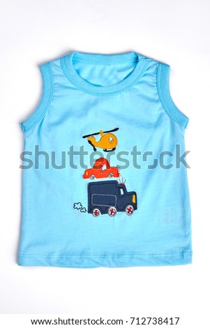 Blue cartoon t-shirt for toddler boy. Baby-boy natural t-shirt with transport print, isolated on white. Cute cartoon t-shirt for infant boy.