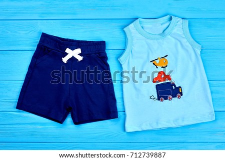 Baby-boy trendy cotton summer suit. Dark blue textile shorts and cartoon transport t-shirt for little boys. Newborn boy summer outfit.