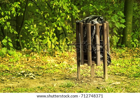 wooden garbage bin in the public park