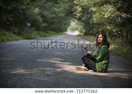 girl with laptop on the road