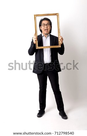 The Asian man holding the vintage picture frame.
