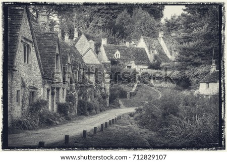 Vintage photo effect Arlington Row in Cotswolds countryside landscape in England