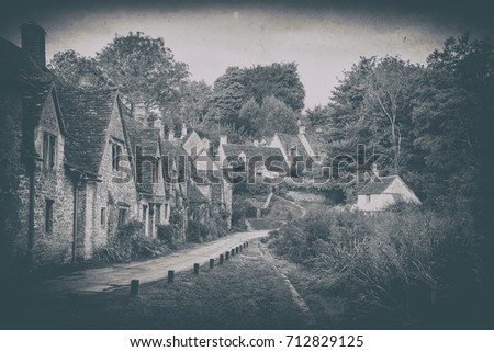 Vintage photo effect Arlington Row in Cotswolds countryside landscape in England