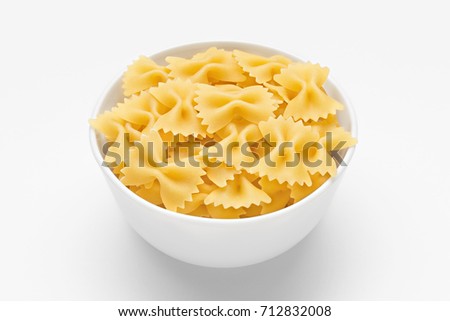 Pasta farfalle close-up in white bowl, on white background