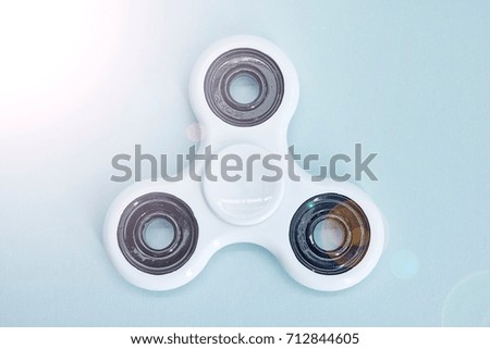 A studio photo of a finger spinner