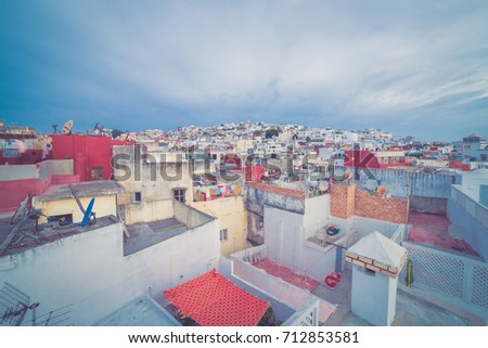 Dark landscape night sky background of Tangier, Morocco with buildings lighs