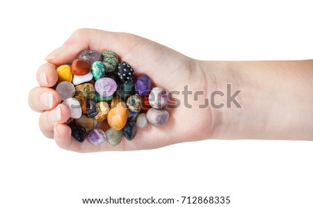 top view of handful with various gems isolated on white background Royalty-Free Stock Photo #712868335