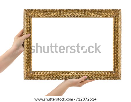 Wooden picture frame in hands isolated on white background