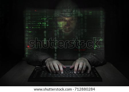 Hacker at work with graphic user interface around