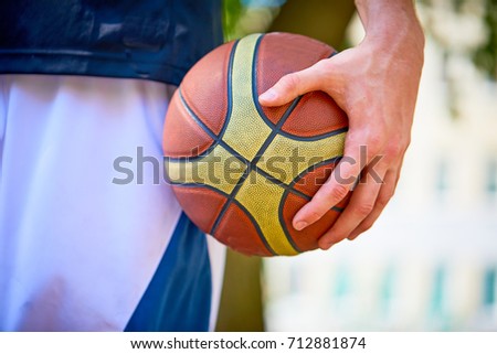 man holding a basketball