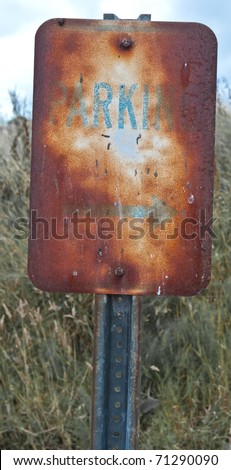 Old rusty parking sign