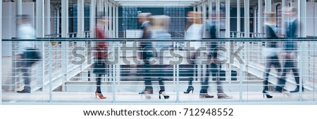 People talking in office corridor, industrial interior, panorama Royalty-Free Stock Photo #712948552