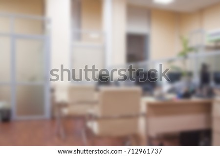 Office workers at work. The interior of working office space. Blurred background for design