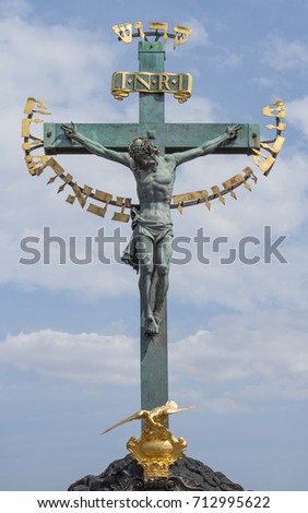 Jesus Christ on the Cross. Colorful photo with blue sky and clouds