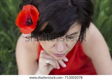 woman with poppy flower