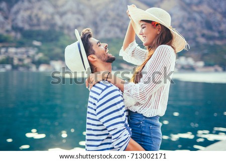 Couple in love, enjoying the summer time by the sea. Royalty-Free Stock Photo #713002171