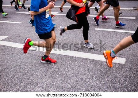 Runners competing in a race Royalty-Free Stock Photo #713004004