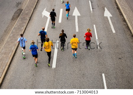 Runners competing in a race Royalty-Free Stock Photo #713004013