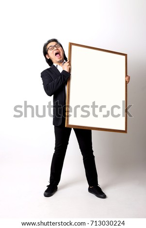 The Asian businessman with the picture frame on the white background.