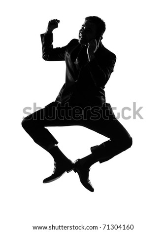 silhouette caucasian business man  expressing winning jumping on the phonebehavior full length on studio isolated white background