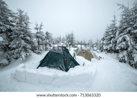 Frozen tents in the high mountain on winter time. Landscape photography