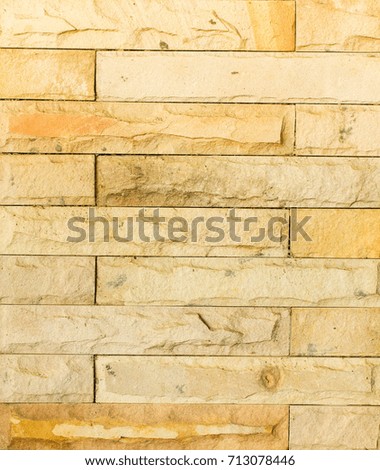 Brick wall outside of a house it feel strong.