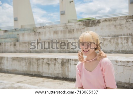 Asian hipsters girl posing for take a photo,lifestyle of modern woman,Thai people in hippie style golden hairs