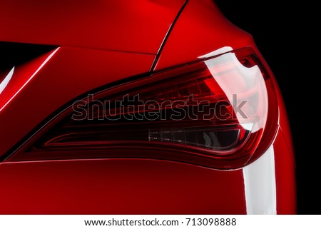 Car detailing series: Closeup of red car taillights Royalty-Free Stock Photo #713098888