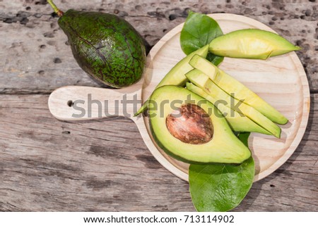 Avocado turned piece on wooden tray