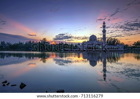 The Tengku Tengah Zaharah Mosque or the Floating Mosque at sunset.  It is the first floating mosque in Malaysia. It is situated in Kuala Ibai Lagoon near the estuary of Kuala Ibai River.