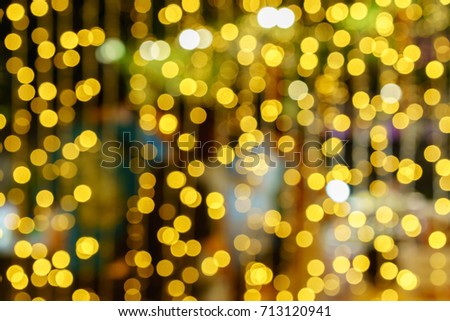 Defocused lights abstract golden nonagon bokeh background 