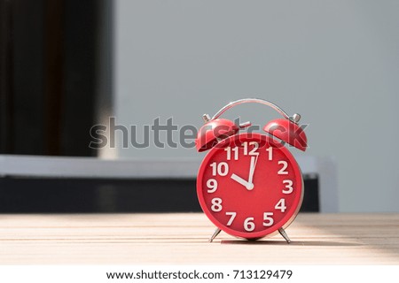 modern clock on wood table 