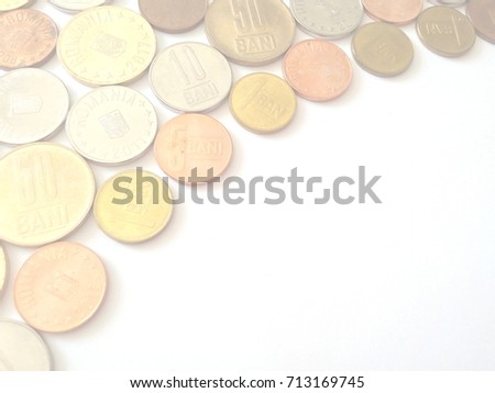 Various Romanian coins on white background with copy space in the lower right corner
