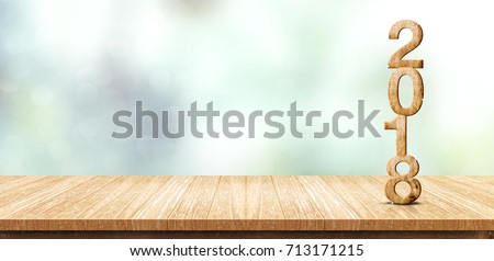 New year 2018 wood number (3d rendering) on wooden plank table at blur abstract green bokeh background,Mock up banner space for display or montage of product,business presentation Royalty-Free Stock Photo #713171215