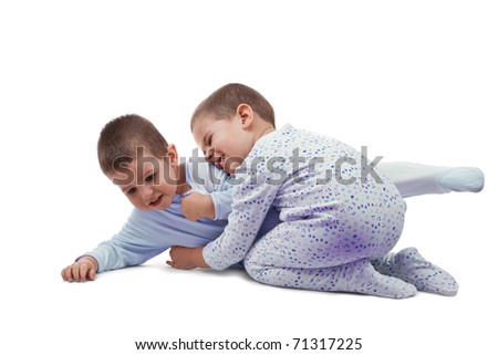 Two young boys playing around and laughing from joy; isolated on white