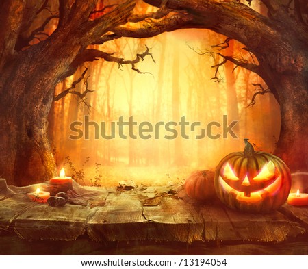 Halloween pumpkin. Scary pumpkin on table. Halloween background. Pumpkins in forest