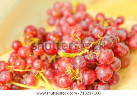 red grapes on plate, blurred picture, selective focus