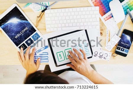 woman designing responsive website. Some elements furnished by nasa