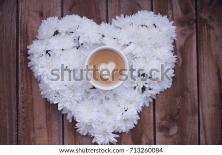 heart of white flowers. morning and espresso. Romance. Wooden background